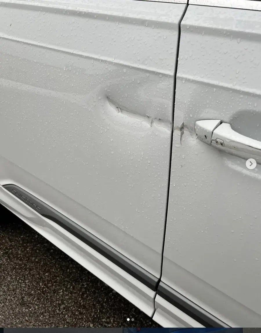 Audi Quattro door dent and crease before repair